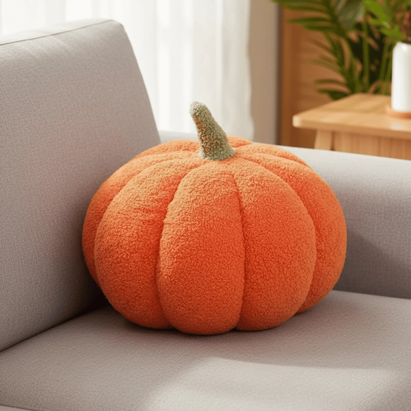 Coussin Citrouille en situation sur un canapé